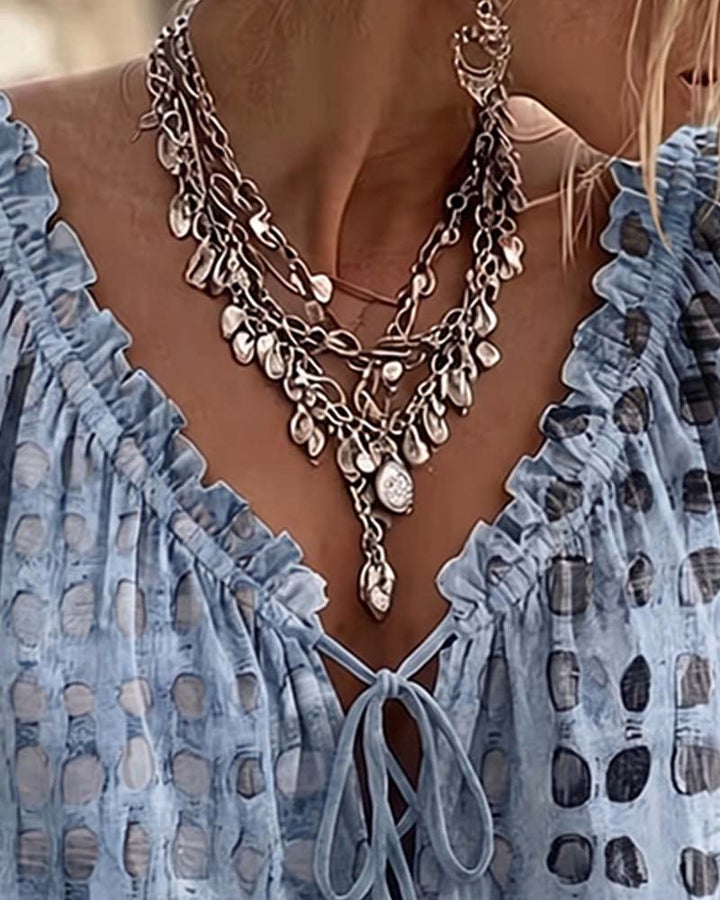 Lena | Blouse met stippenpatroon en vetersluiting