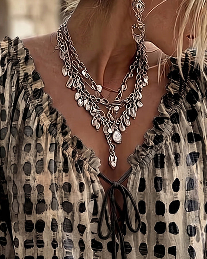 Lena | Blouse met stippenpatroon en vetersluiting